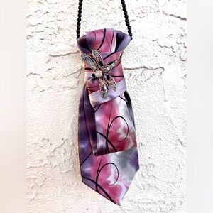 Silk tie necklace with dragonfly brooch